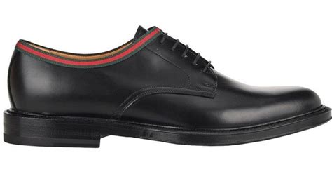 black Gucci lace up shoes